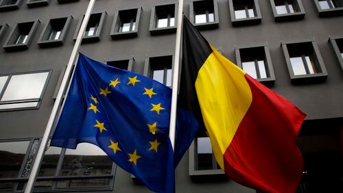 The European and the Belgian national flag set on half staff after terrorist attacks in Brussels in front of the Belgium Embassy in Berlin, Germany, Tuesday, March 22, 2016. (AP Photo/Markus Schreiber)