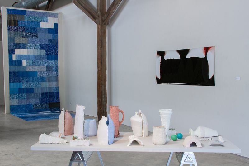 (From left to right) Jessica Machacek’s “Curtain: Blue Majestic With Ocean Bottom” in pool vinyl; Elizabeth Lide’s “Dirty Laundry” in plaster and paper pulp; and Christina Price Washington’s “Couch,” photogram. CONTRIBUTED BY BRITTAINY LAUBACK