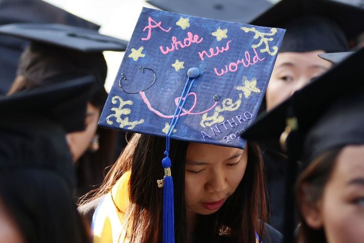 Arts and Science student Jasmine Lin shows a message on her hat as students take place at the start of the ceremony during Emory University’s 2022 Commencement on Monday, May 9, 2022. Fifteen thousand people were expected to attend. Miguel Martinez /miguel.martinezjimenez@ajc.com