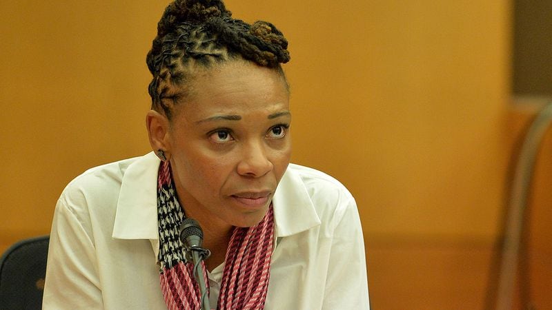Tameka Butler-Grant testifies at the APS trial in 2014. (Kent D. Johnson / kdjohnson@ajc.com)