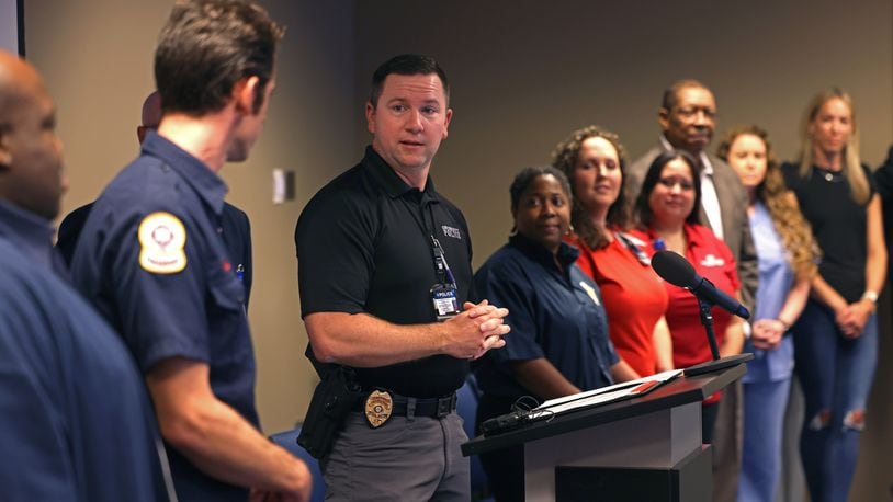Gwinnett County Police officer Doug Loomis thanks first responders that helped him after going into cardiac arrest during an event at the Gwinnett County Justice and Administration Center, Wednesday, September 21, 2022, in Lawrenceville. (Jason Getz / Jason.Getz@ajc.com)