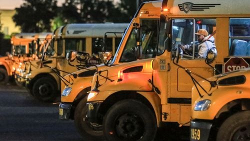 A DeKalb County School District bus driver pulls out from a row of parked buses at the DeKalb County School District complex at 1701 Mountain Industrial Boulevard in Stone Mountain on Friday, April 20, 2018. (AJC FILE PHOTO)