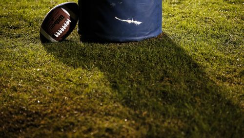 A football rests against the goalpost during the first half of a high school football game between Lanier and Dacula at Dacula High School in Dacula, Ga., on Friday, Oct. 26, 2018. (Casey Sykes for The Atlanta Journal-Constitution)