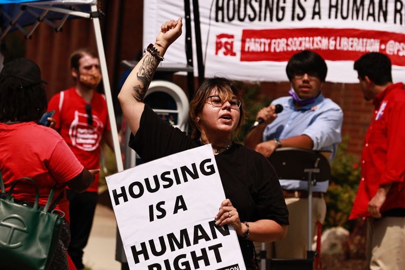 Residents of the Forest at Columbia Apartments and activists from the Party for Socialism and LIberation rallied outside the DeKalb County government building in Decatur Thursday.