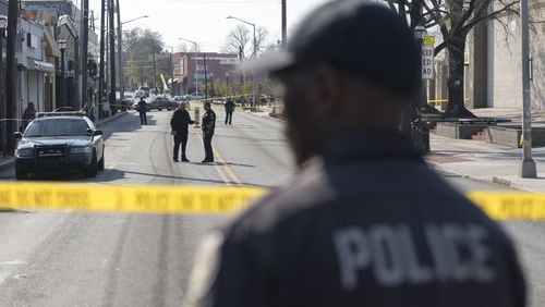 Police block off a section of Ralph David Abernathy Boulevard after a shooting at West End mall in Atlanta on Friday. (DAVID BARNES / SPECIAL)