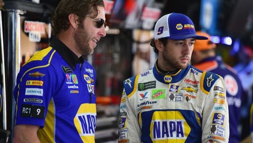 Chase Elliott (R) confers with crew chief Alan Gustafson in the garage area at AMS during practice for Sunday's Folds of Honor QuikTrip 500.  (Jared C. Tilton/Getty Images)