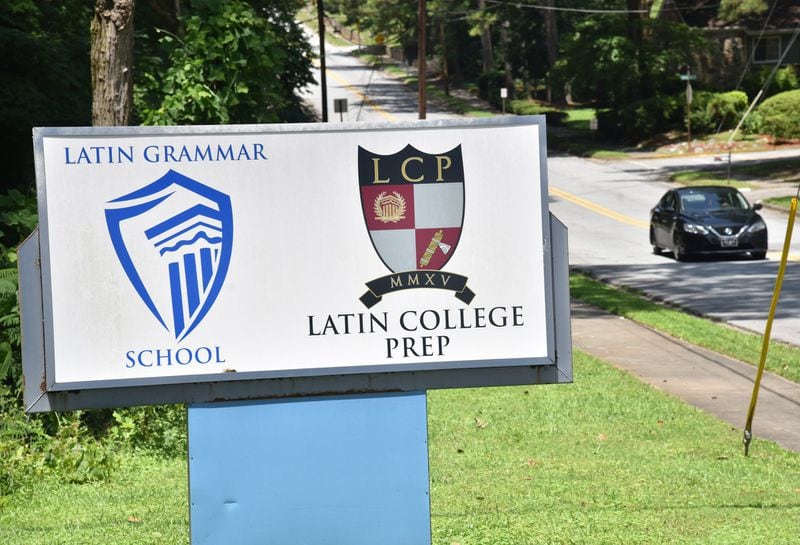 A sign for Latin Grammar School and Latin College Preparatory School is displayed in East Point on Friday, June 29, 2018. Latin College Prep recently purchased the former Oak Knoll Elementary from Fulton County Schools. The school building has and will continue to house Latin College Prep (a middle school) and Latin Grammar (an elementary school). Now that the charter school has ownership of the property, they will be doing some renovation work to it - including beefing up security, adding an outside gate, and doing some classroom refreshing. HYOSUB SHIN / HSHIN@AJC.COM