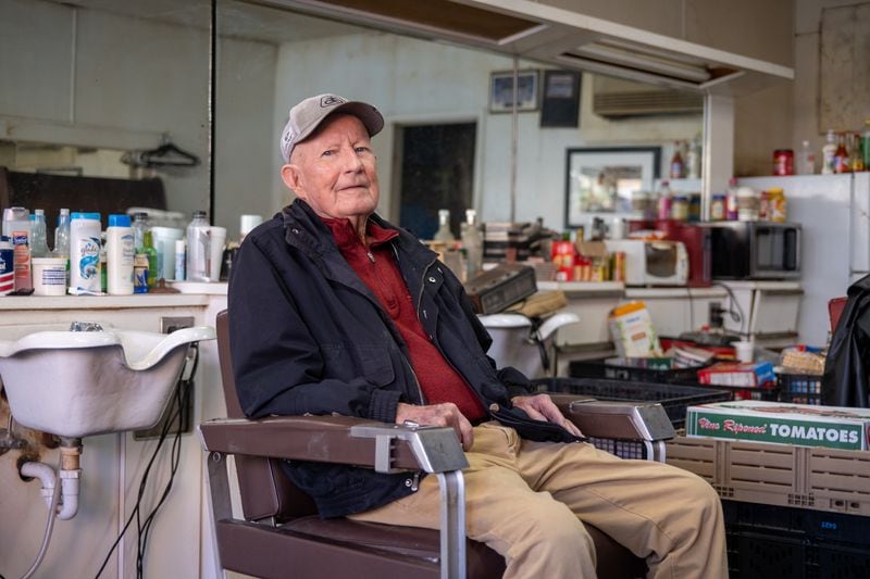 James “Soapy” Herndon poses for a portrait at Soapy’s Barber Shop in Americus on Saturday, March 4, 2023. Herndon was longtime barber to Jimmy Carter. (Arvin Temkar / arvin.temkar@ajc.com)