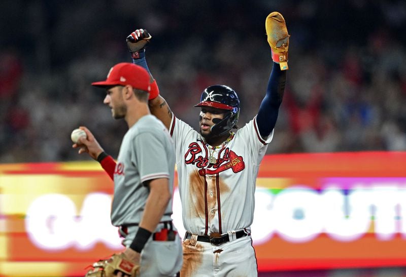 Braves' Ronald Acuna Jr. (13) celebrates after stealing a second base during the fifth inning at Truist Park, Tuesday, September 19, 2023, in Atlanta. (Hyosub Shin / Hyosub.Shin@ajc.com)