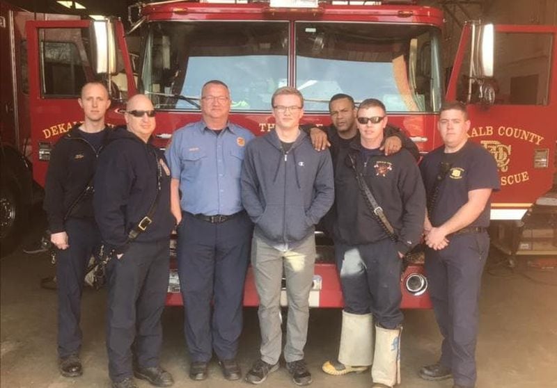 Martin (wearing light blue) with a crew at a DeKalb fire station