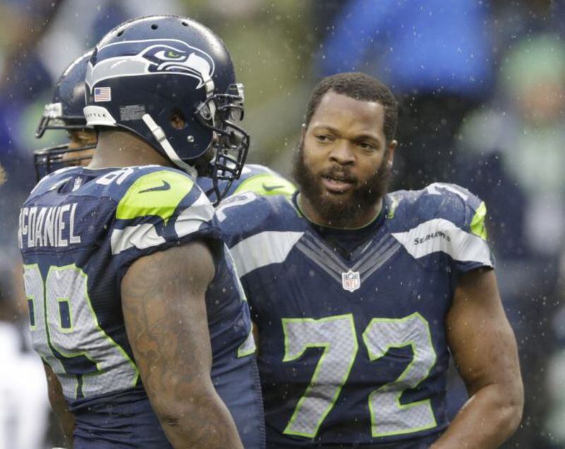 Michael Bennett (72) reportedly wants to be traded to the Atlanta Falcons to be reunited with head coach Dan Quinn. (Scott Eklund/Associated Press)