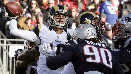 FILE - In this Sunday, Dec. 4, 2016 file photo, Los Angeles Rams quarterback Jared Goff (16) passes over New England Patriots defensive lineman Malcom Brown (90) during the first half of an NFL football game in Foxborough, Mass. When Jared Goff was preparing to become the No. 1 pick in the NFL draft earlier this year, many scouts and observers compared him to Matt Ryan, the veteran quarterback of the Atlanta Falcons. (AP Photo/Steven Senne, File)