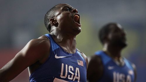 Atlanta's Christian Coleman is jubilant after winning the men's 100-meter final at last September's World Athletics Championships in Doha, Qatar. His Olympic moment has been put on hold. (AP Photo/Petr David Josek)