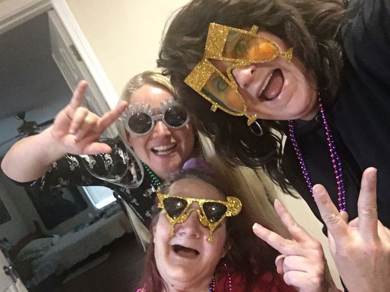 Inge King (bottom), Mariann Marksberry (right) and Rachel Raja "getting silly" before a New Year's Eve party, Marksberry said.