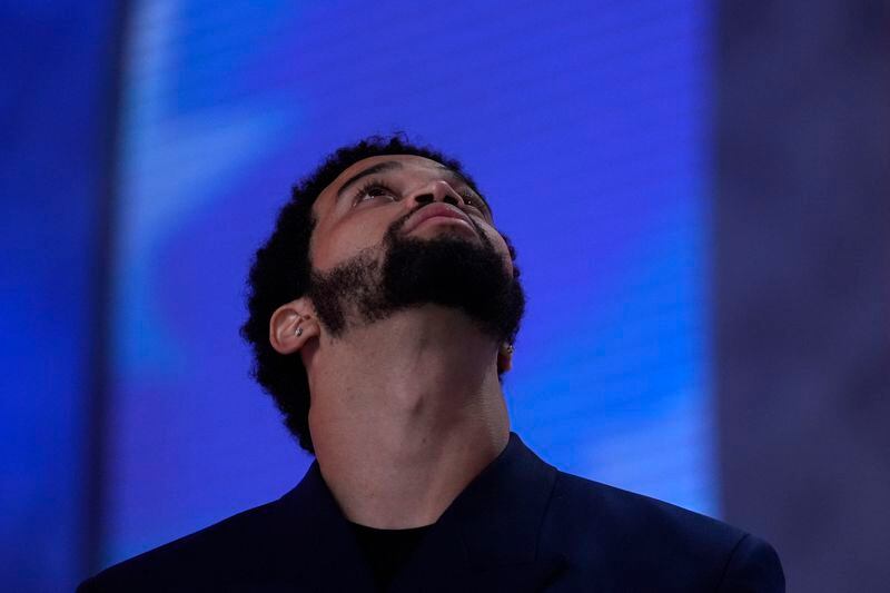 Southern California quarterback Caleb Williams stands on stage before the first round of the NFL football draft, Thursday, April 25, 2024, in Detroit. (AP Photo/Jeff Roberson)