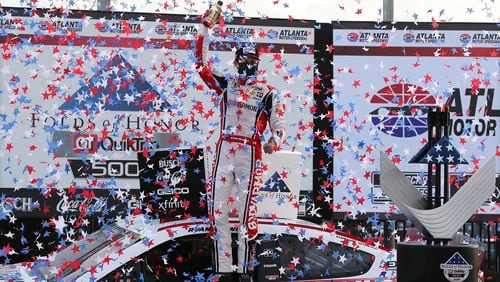 Ryan Blaney is showered with stars as he celebrates winning the Atlanta Motor Speedway Folds of Honor QuickTrip 500 in victory lane on Sunday, March 21, 2021, in Hampton. Curtis Compton / Curtis.Compton@ajc.com