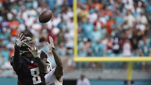 Falcons tight end Kyle Pitts (8) makes a catch as Miami Dolphins cornerback Xavien Howard (25) defends during the second half Sunday, Oct. 24, 2021, in Miami Gardens, Fla. (Hans Deryk/AP)