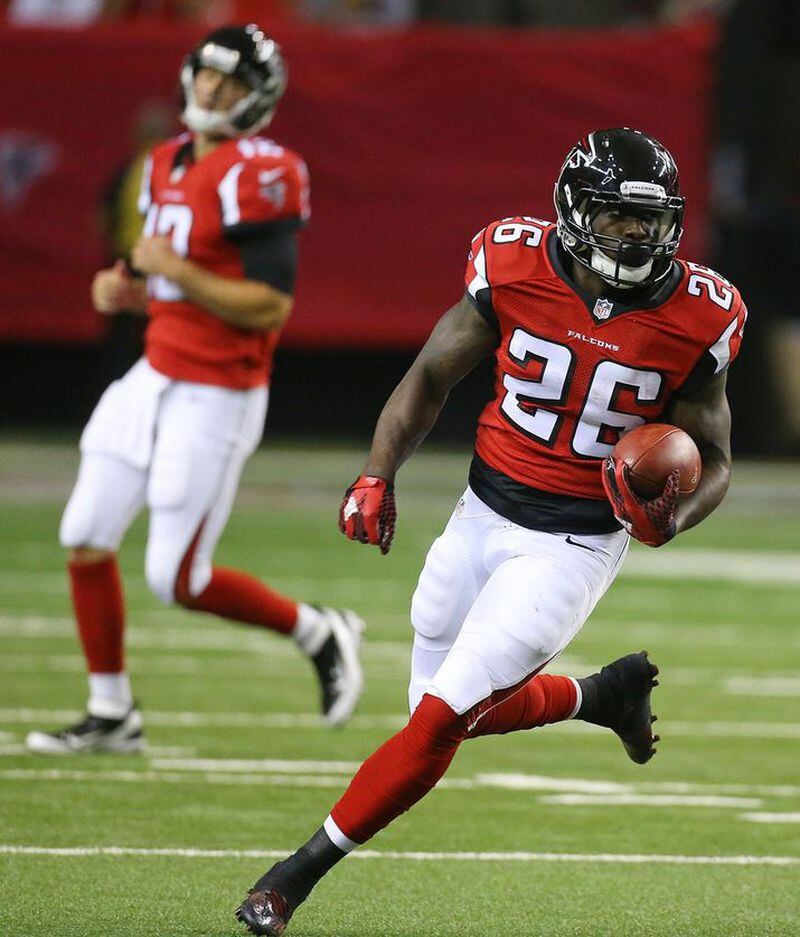 Falcons running back Tevin Coleman finds some running room after the handoff from quarterback Sean Renfree (left) during the first quarter of their final preseason game on Thursday, Sept. 3, 2015, in Atlanta. Curtis Compton / ccompton@ajc.com