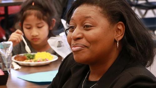 Principal Stephanie Brown-Bryant discusses the benefit of students having lunch served during spring break. Beauty Lay, 7, is one of hundreds enjoying their meal at Indian Creek Elementary School on Tuesday, April 2, 2019, in Clarkston. CURTIS COMPTON/CCOMPTON@AJC.COM