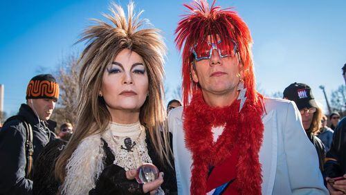 Two David Bowie fans donned full regalia for an impromptu parade Sunday in honor of the late rock star. Photo: Steve Eberhardt