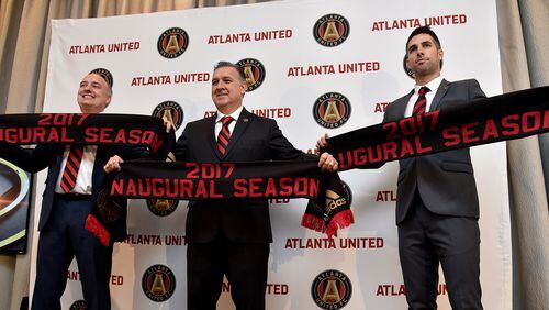 Atlanta United president Darren Eales (left), manager Gerardo "Tata" Martino and technical director Carlos Bocanegra were introduced to the media during a press conference last September. (AJC staff photo)
