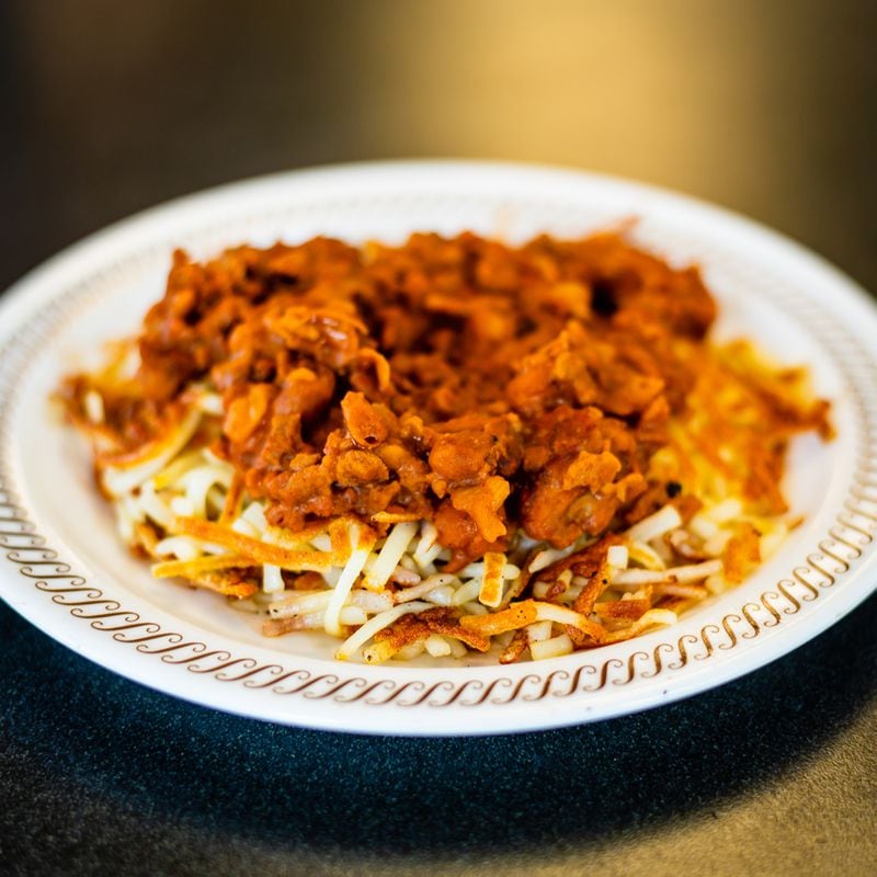 Topped hash browns from Waffle House with Bert's Chili.