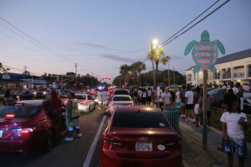Party-goers hang out in the street during stand-still traffic caused by Orange Crush on Saturday. (Photo Courtesy of RJ Smith/Savannah Morning News)