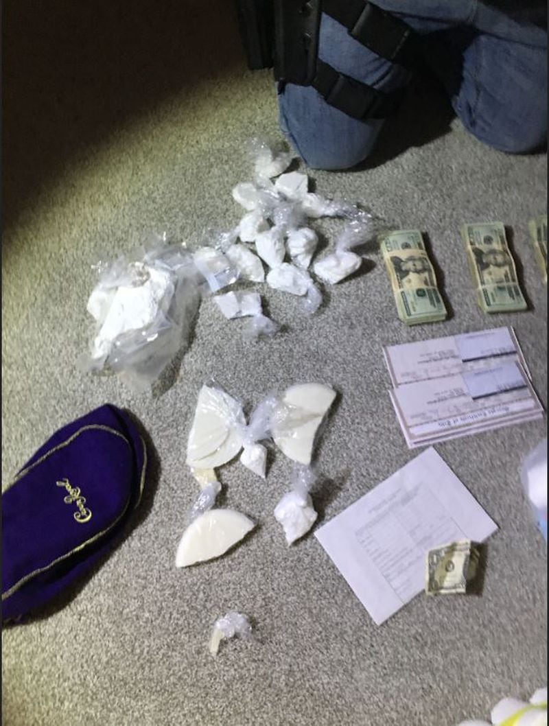 Two pounds of powder and suspected crack cocaine and suspected marijuana were recovered when Drug Task Force officers executed a search warrant at a McDonough home. (Credit: Flint Circuit Drug Task Force)
