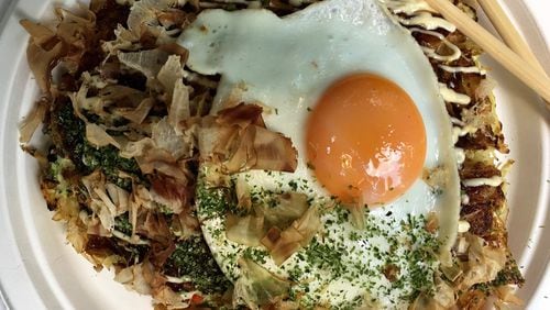 The pleasure of okonomiyaki at Ok Yaki is all about contrasting textures and flavors. CONTRIBUTED BY WYATT WILLIAMS