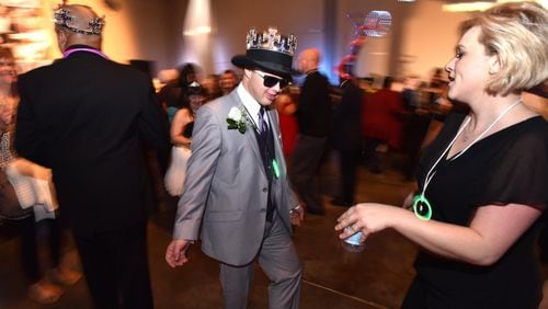 Dale Potter and his date, Becall Johns (right), dance during the “Night to Shine” event on Feb. 8 at First Baptist Church Atlanta in Dunwoody. HYOSUB SHIN / HSHIN@AJC.COM