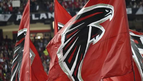 January 22, 2017, Atlanta - Falcons flags are flown after scoring a touchdown during the NFC Championship game against the Packers in Atlanta, Georgia, on Sunday, January 22, 2017. (DAVID BARNES / DAVID.BARNES@AJC.COM)