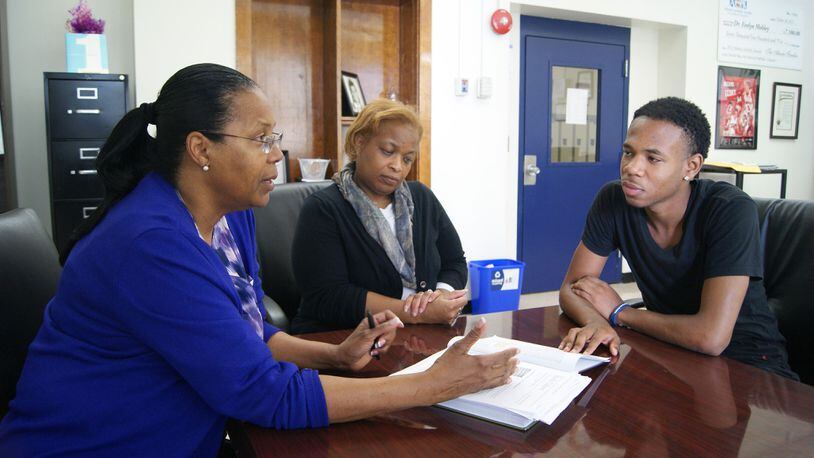 West End Academy Principal Evelyn Mobley (left) and CIS Site Coordinator Lisa Wilson meet with student Traveon Watkins. The CIS program supports students by removing barriers outside the classroom that may impede their ability to learn.