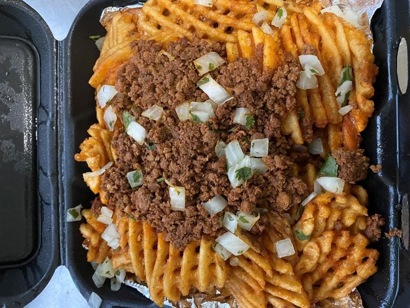 Lean Draft House offers lots of good beer-drinking food: nachos, wings and these loaded chorizo fries.
Wendell Brock for The Atlanta Journal-Constitution
