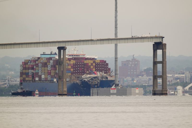Tugboats escort the cargo ship Dali after it was refloated in Baltimore, Monday, May 20, 2024. The container ship that caused the deadly collapse of Baltimore's Francis Scott Key Bridge was refloated Monday and has begun slowly moving back to port. (AP Photo/Matt Rourke)
