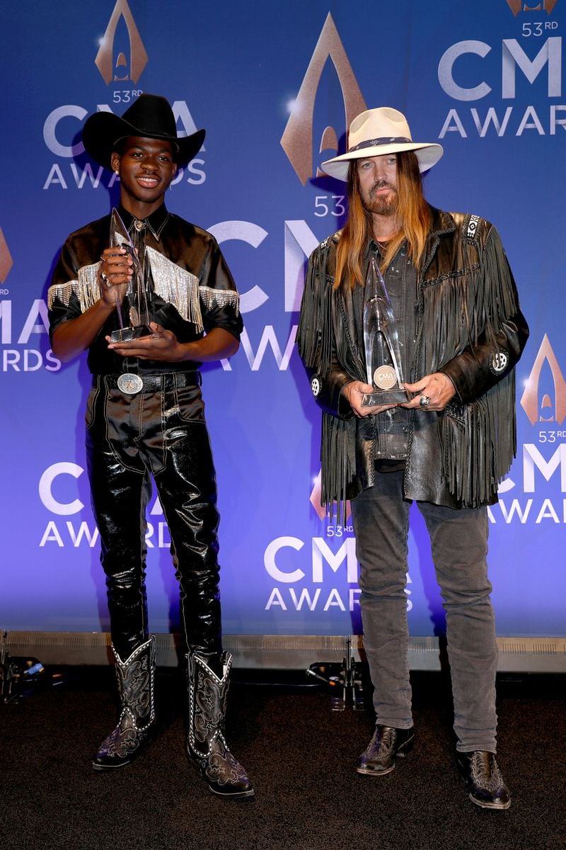 Lil Nas X (L) and Billy Ray Cyrus pose in the press room of the 53rd annual CMA Awards at the Bridgestone Arena on November 13, 2019 in Nashville, Tennessee. (Photo by Leah Puttkammer/Getty Images)