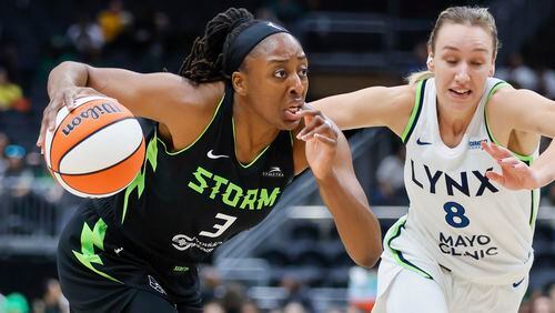 Seattle Storm forward Nneka Ogwumike drives to the basket past Minnesota Lynx forward Alanna Smith during the first quarter of a WNBA basketball game Tuesday, May 14, 2024, in Seattle. (Jennifer Buchanan/The Seattle Times via AP)
