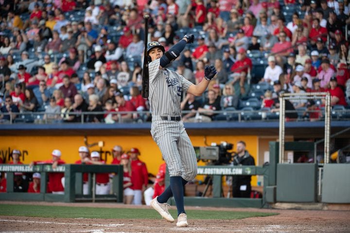 Georgia Tech first baseman Angelo DiSpigna tosses his bat toward the dugout after being walked during the 20th Spring Classic game on Sunday at Coolray Field in Lawrenceville. (Jamie Spaar / for The Atlanta Journal-Constitution)