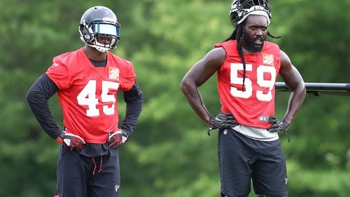 Linebackers Deion Jones (left) and De'Vondre Campbell are often in the same frame when on the field - or off. (Curtis Compton/ccompton@ajc.com)