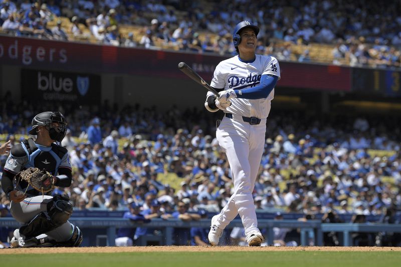 Los Angeles Dodgers designated hitter Shohei Ohtani takes a strike as Miami Marlins catcher Nick Fortes kneels behind the plate during the eighth inning of a baseball game Wednesday, May 8, 2024, in Los Angeles. (AP Photo/Mark J. Terrill)