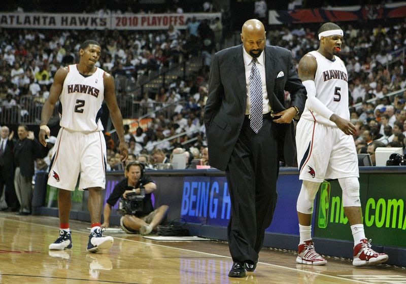 Atlanta Hawks head coach Mike Woodson, guard Joe Johnson (2), and forward Josh Smith (5) head to the bench for a time out during the second half of a 105-75 loss to the Orlando Magic in game 3 of the  Eastern Conference semifinals Saturday, May 8, 2010, at Philips Arena in Atlanta. (Curtis Compton/ccompton@ajc.com)