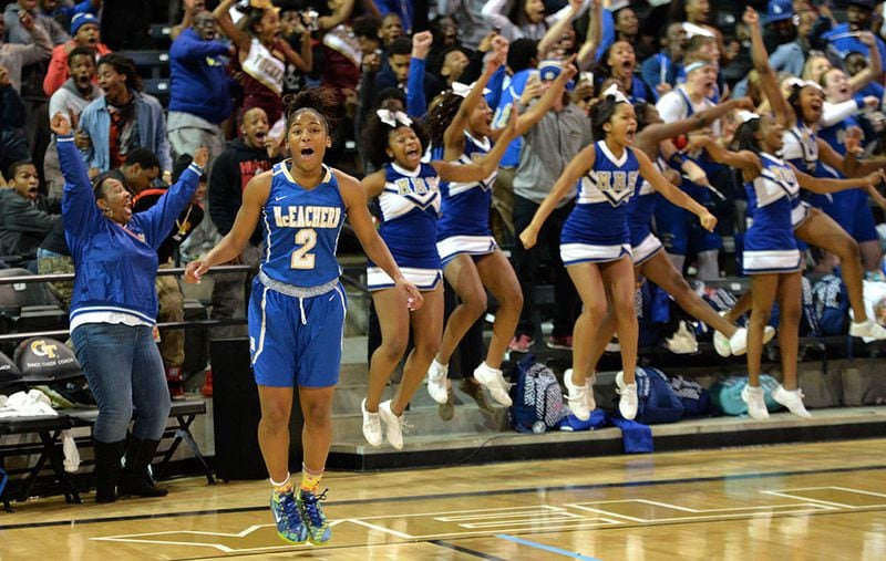 February 28, 2015 Atlanta - McEachern's Te'a Cooper (2) reacts after she scored the game wining goal to beat 59-57 over Archer at the end of 4th quarter at McCamish Pavilion in Georgia Tech campus on Saturday, February 28, 2015. McEachern defeated Archer 59-57 in the Class AAAAAA high school basketball tournament. HYOSUB SHIN / HSHIN@AJC.COM McEachern's Te'a Cooper (2) reacts after she scored the game wining goal in the Class AAAAAA high school basketball tournament over Archer. (Hyosub Shin / AJC)