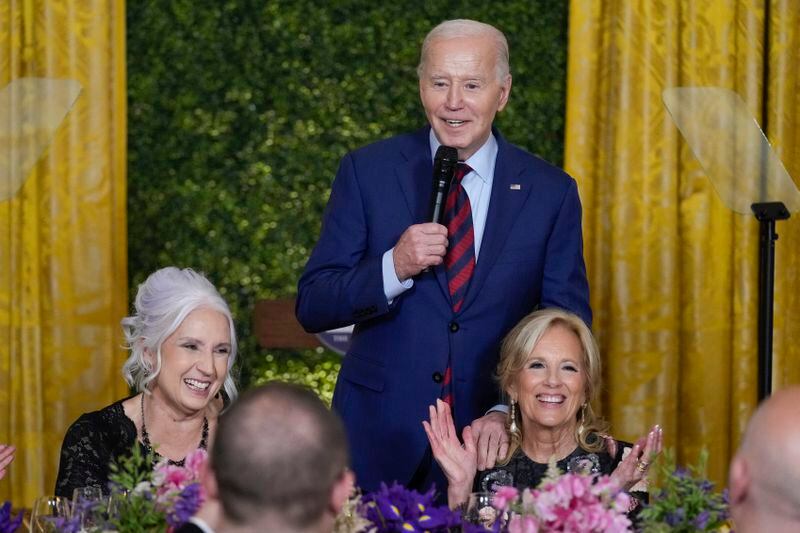 President Joe Biden speaks as Missy Testerman, the 2024 National Teacher of the Year, and first lady Jill Biden listen during a State Dinner at the White House in Washington, Thursday, May 2, 2024, to honor the 2024 National Teacher of the Year and other teachers from across the United States. (AP Photo/Susan Walsh)