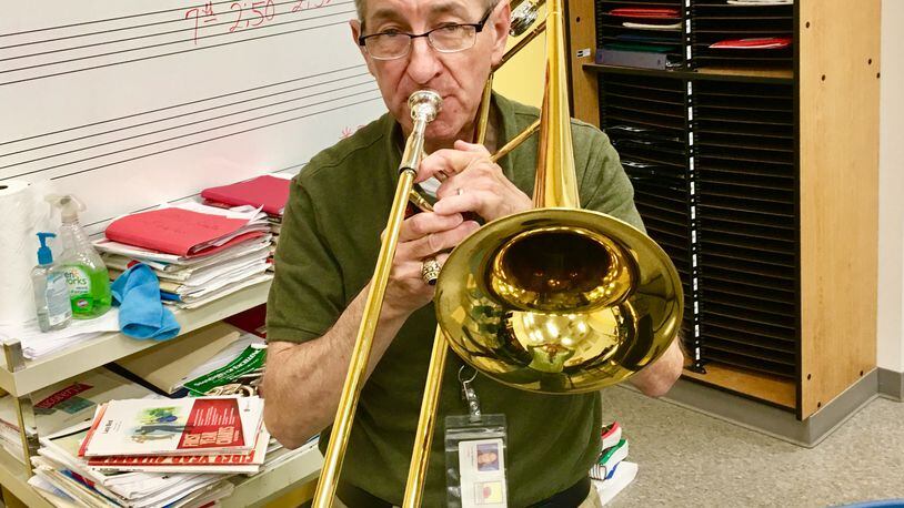 David Williams, who describes himself as “an old trombone player,” is retiring after 34 years as band director at Renfroe Middle School. Bill Banks for the AJC