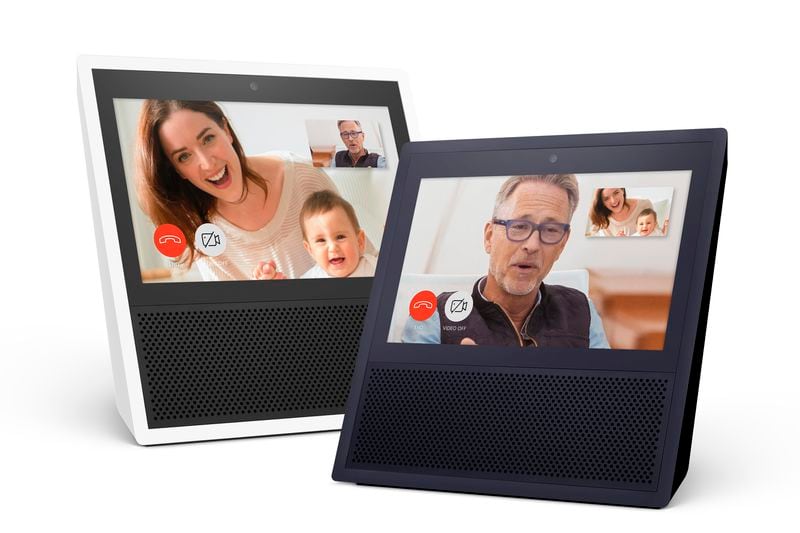 This photo provided by Amazon shows models of the Amazon Echo Show. Amazon is giving its voice-enabled Echo speaker a touch screen and video-calling capabilities as it competes with Google's efforts at bringing "smarts" to the home. The new device, called Echo Show, goes on sale on June 28, 2017. Amazon says it's also bringing calling and messaging features to its existing Echo and Echo Dot devices and the Alexa app for phones. (Amazon via AP)