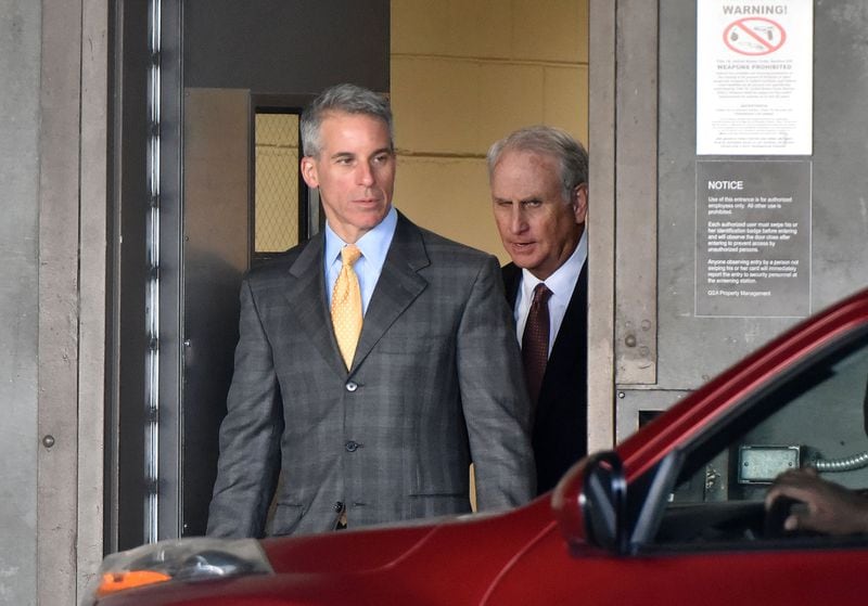 Brian Steel, left, defense attorney for Adam Smith, leaves the federal courthouse after a hearing on Tuesday. Smith became the first former senior city official to plead guilty in the Atlanta City Hall bribery scandal. HYOSUB SHIN / HSHIN@AJC.COM