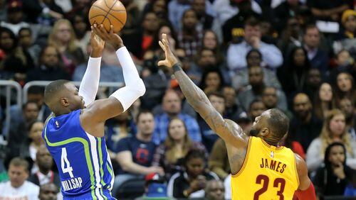Hawks’ Paul Millsap shoots for two over Cavaliers’ LeBron James during the first half in a NBA basketball game at Philips Arena on Friday, March 3, 2017, in Atlanta. Curtis Compton/ccompton@ajc.com