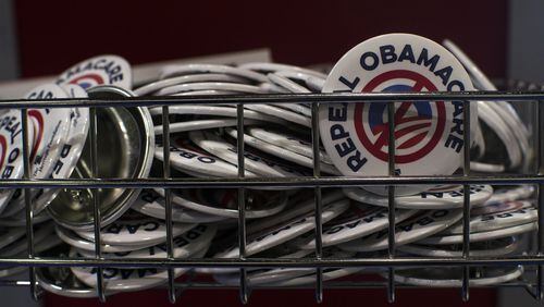 “Repeal Obamacare” buttons fill a basket at a Heritage Foundation booth during the Conservative Political Action Conference in Maryland earlier this year. Georgia’s Health Care Reform Task Force plans to tackle Medicaid reform, among other things. Gabriella Demczuk/The New York Times