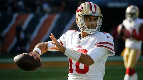 San Francisco 49ers quarterback Jimmy Garoppolo (10) warms up before an NFL football game against the Chicago Bears, Sunday, Dec. 3, 2017, in Chicago. (AP Photo/Charles Rex Arbogast)