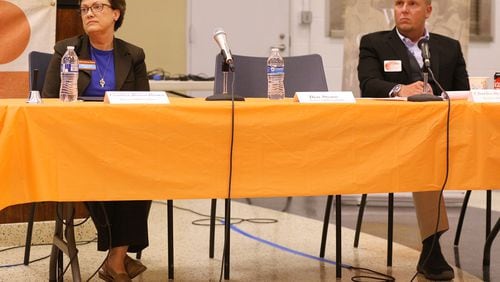 Atlanta school board member Cynthia Briscoe Brown (left) and challenger Charles Stadtlander participate in an election forum in August.  Stadtlander filed an ethics complaint against the incumbent.  Curtis Compton/ccompton@ajc.com