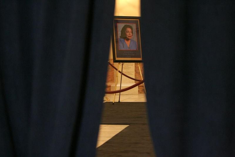 A portrait of Coretta Scott King sat in the Capitol rotunda behind black curtains on Feb. 3, 2006 in preparation for her body to lie in state. (Ben Gray/AJC staff)